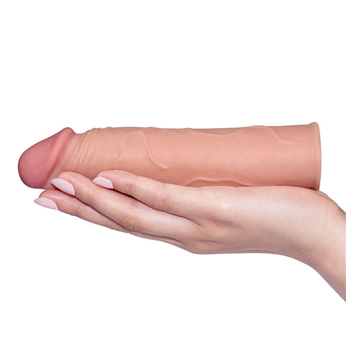 Pleasure X-Tender 1 Inch Penis Extension Sleeve In Hand